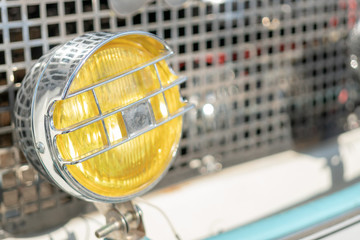Yellow, chrome headlight retro car.