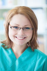 Smiling nurse with glasses