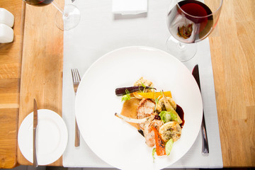 Meat dish with vegetables served in a restaurant