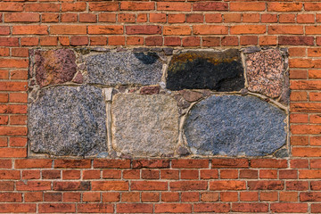 old wall of natural stone and red kirich