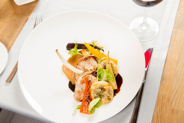 Meat dish with vegetables served in a restaurant