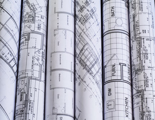 rolls of architecture blueprints & house plans. background