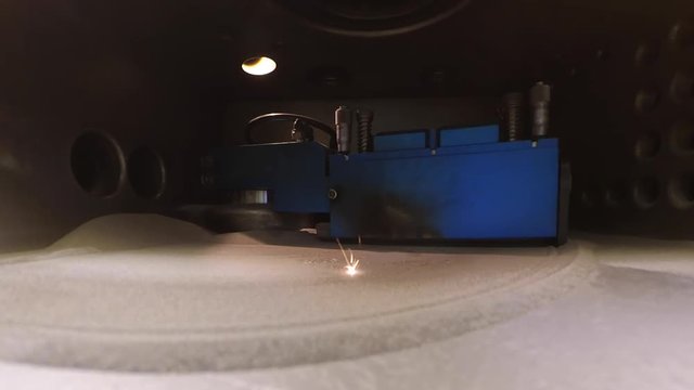 Working chamber Laser sintering machine for metal inside. Metal is sintered under the action of laser into desired shape in working chamber. 3D printer printing metal. Modern additive technologies