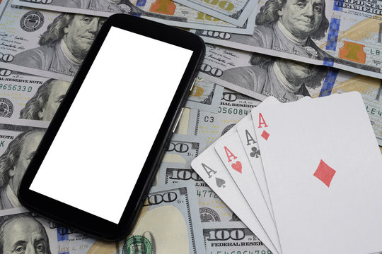 virtual casinos, real money. cell phone, dollar and playing cards