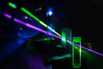 Experiment with lasers in the laboratory of Photonics - obrazy, fototapety, plakaty