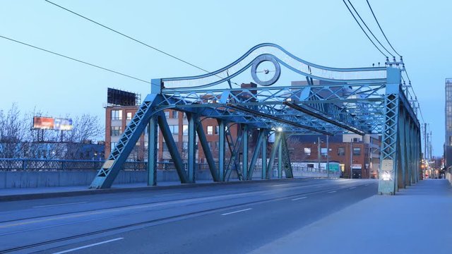 Timelapse of the Queen Street Bridge in Toronto at twilight 4K