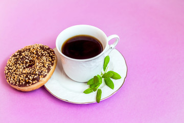 Coffee with mint and donut.
