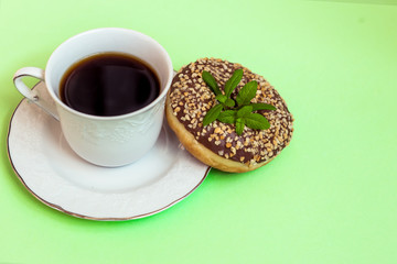 Coffee with mint and donut.
