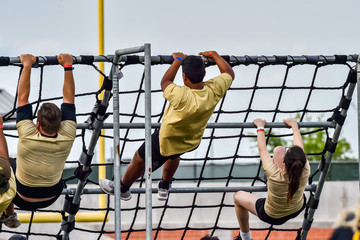 Athletes competing on an obstacle course