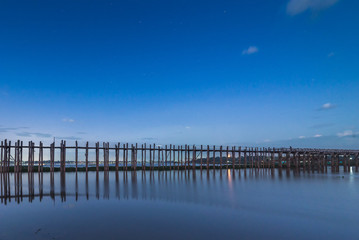 Fototapeta premium U Bein Bridge, wood structure bridge near Mandalay, peaceful and beautiful site, Myanmar