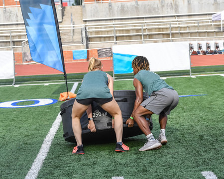 Athletes competing on an obstacle course
