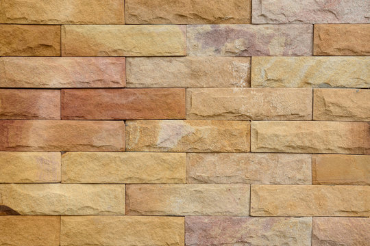 Sandstone wall texture closeup for background.