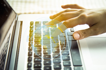 Young woman using laptop computer.  businessman hand working with modern technology and digital layer effect as business strategy concept