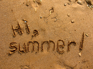 Hi, Summer written on the beach sea sand. Textured sandy template for vacation concepts. Natural background