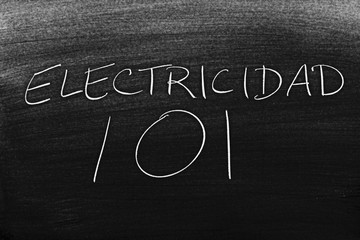 Fototapeta premium The words Electricidad 101 on a blackboard in chalk. Translation: Electricity 101