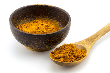 Turmeric (Curcuma) powder on wooden spoon on white background.