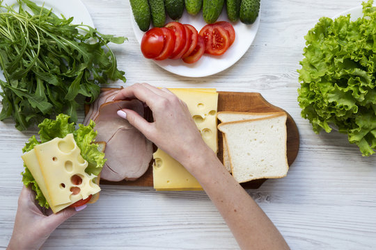 Mother Preparing Food For Lunch Box, Top View