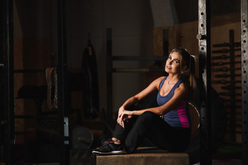 Fototapeta na wymiar Sporty girl posing in a sports hall