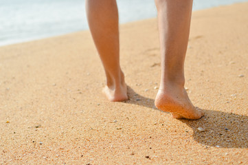 Closeup of man's feet at the shore