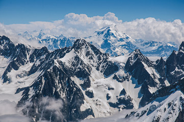 Close-up of snowy peaks and mountains, viewed from the Aiguille du Midi, near Chamonix. A famous ski resort located in Haute-Savoie Province, at the foot of Mont Blanc in the French Alps.