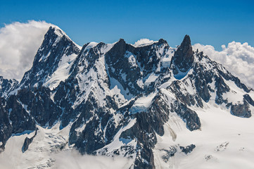 Close-up of snowy peaks and mountains, viewed from the Aiguille du Midi, near Chamonix. A famous ski resort located in Haute-Savoie Province, at the foot of Mont Blanc in the French Alps.