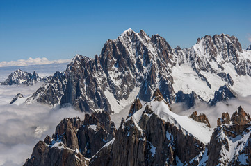 Close-up of snowy peaks and mountains, viewed from the Aiguille du Midi, near Chamonix. A famous ski resort located in Haute-Savoie Province, at the foot of Mont Blanc in the French Alps.