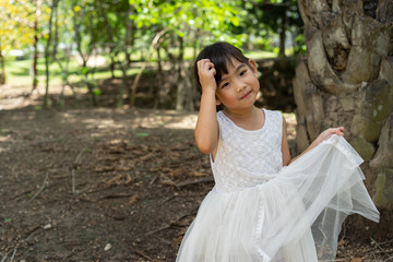 Portrait Asian Thailand kids little girl Children In white dress smiling happy