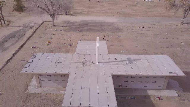 Drone rotates around Cross cemetery desert
