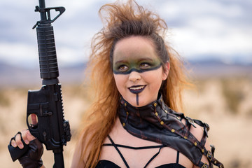 The Queen of the Apocalypse. A female militia soldier in a post-apocalyptic desert wasteland. Urban...