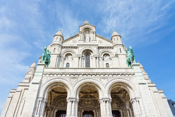 Fototapeta na wymiar Panoramic view of Basilica of the Sacred Heart of Paris with blue cloudy sky in background (Paris, France, Europe).