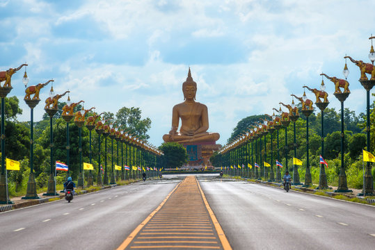 Beautiful biggest Buddha Wat Pikul Thong temple is famous place for worship of the sacred travel destination at Singburi province Thailand.