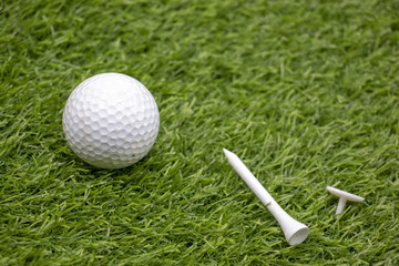 Golf ball is on green grass