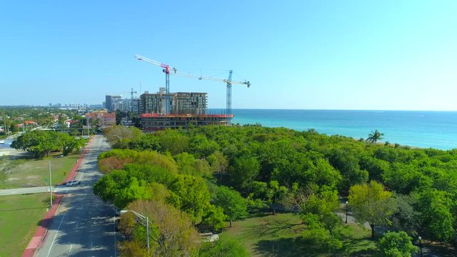 Aerial video construction site cranes on the beach
