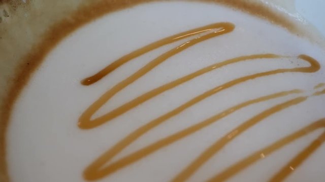 caramel macchiato hot coffee drink, close-up