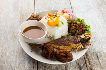 fried chicken and fried fish rice with curry