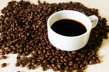 Cup full of coffee beans
