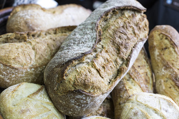 Fresh bread on table close-up. Fresh bread on the kitchen table The healthy eating and traditional bakery