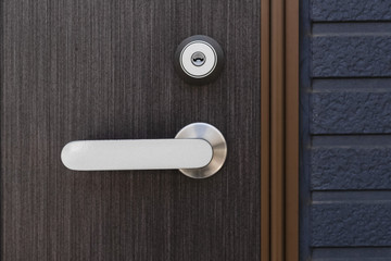 Brown wood door and Door handle with lock