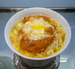 A look through cabinet mirror of Japanese pork cutlet katsudon model for food presentation