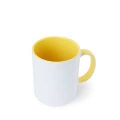 A white mug, with a yellow handle on a light background. 