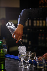 Bartender pours syrup