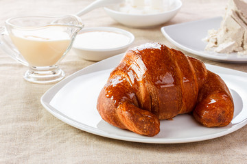 croissant with another sweets on table
