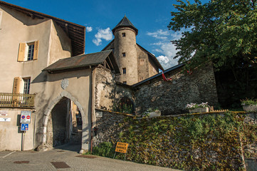 Stone arch at the entrance of Conflans. An historical hamlet near Albertville. Located at the department of Haute-Savoie, southeastern France. Retouched photo.