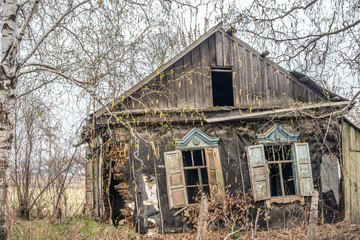 Abandoned destroyed wooden house russian village.
