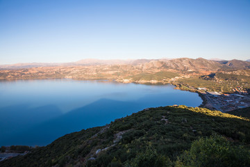 aerial view of beautiful calm water and hills with green vegetation, egirdir, turkey