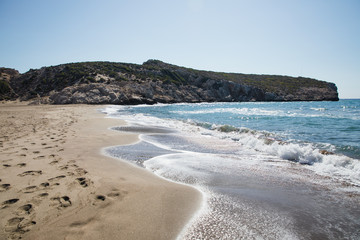 footprints on sandy beach and beautiful sea waves, patara beach, turkey