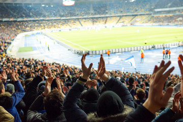 Football- Soccer,a lot of fans in full stadium celebrate there goal in open air roof stadium. © Anton.Matushchak
