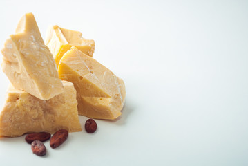 virgin cacao butter pieces on table
