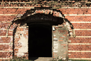doors in a very old red brick fortress