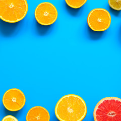Citrus fruits top view border background.